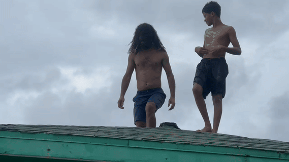 Silly man jumps off gazebo into ocean