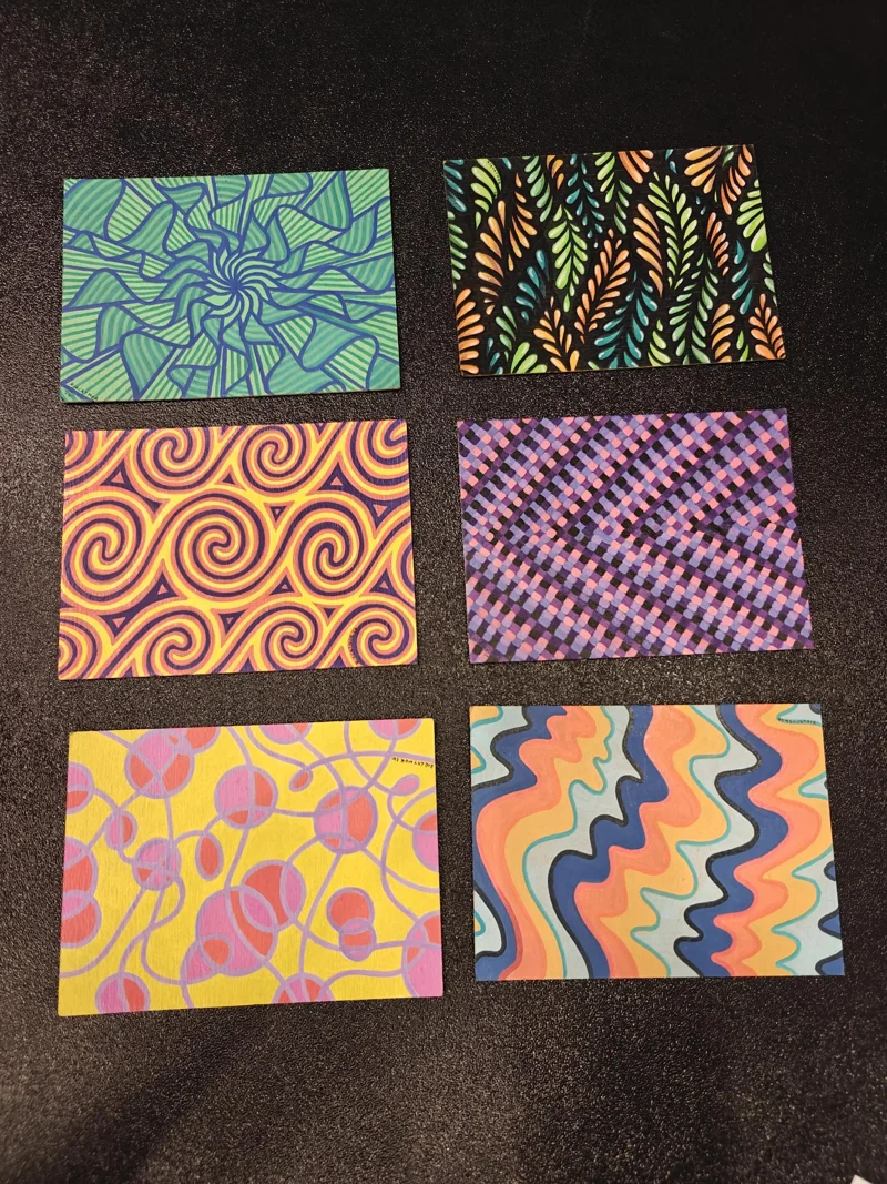 Six rectangular art pieces. Each has a distinct pattern with several colors. Hypnotic, beautiful shapes...
